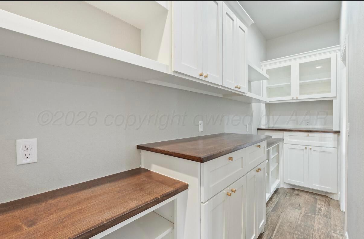 36 Quay Lane Canyon, TX 79015 - Photo 9 of 28 a kitchen with white cabinets and a sink