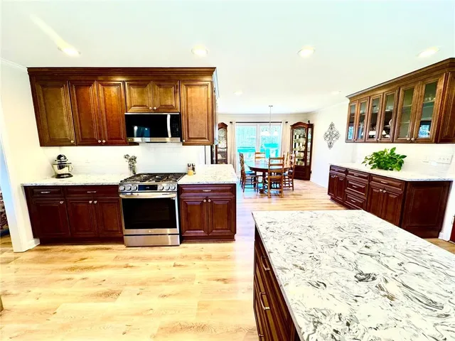 a bedroom with a bed and a night stand