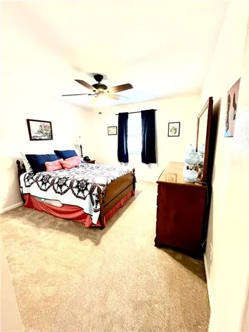 a bathroom with a granite countertop sink