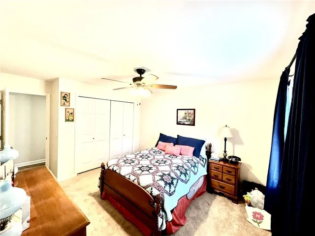 a spacious bathroom with double sink and a mirror