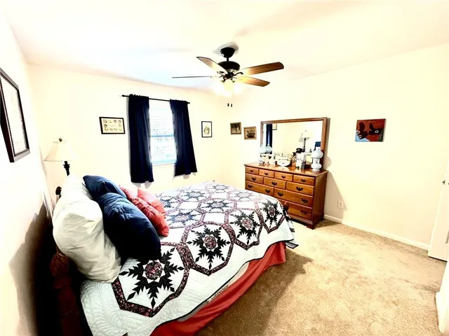 a view of swimming pool with table and chairs in patio