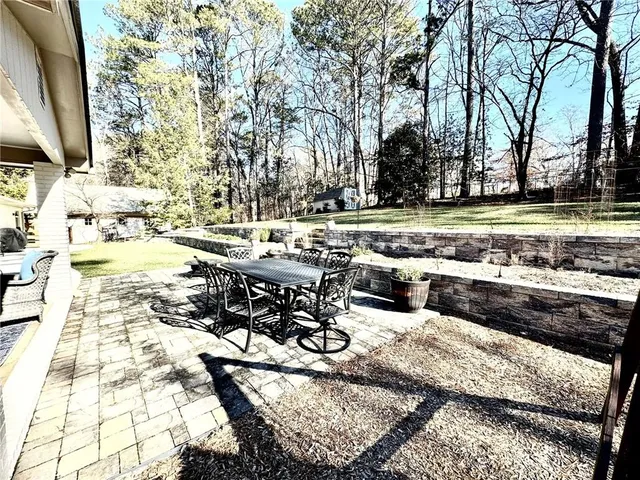a view of a street with large trees