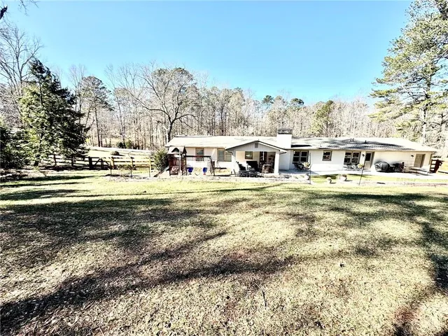 a view of houses with yard