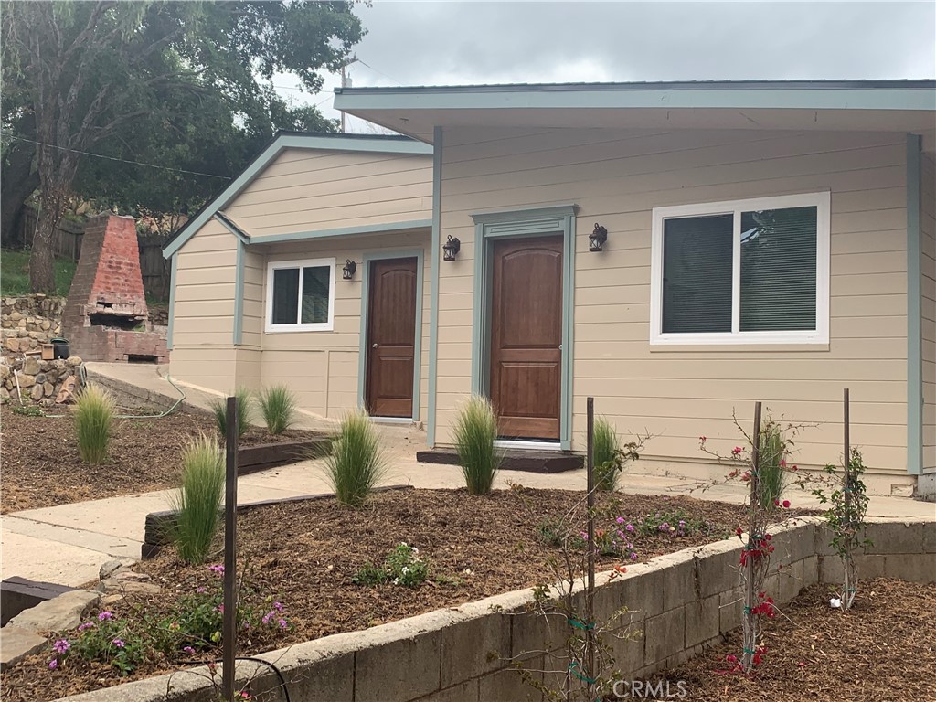 248 Valley Road Oak View, CA 93022 - Photo 1 of 1 a front view of a house with garden