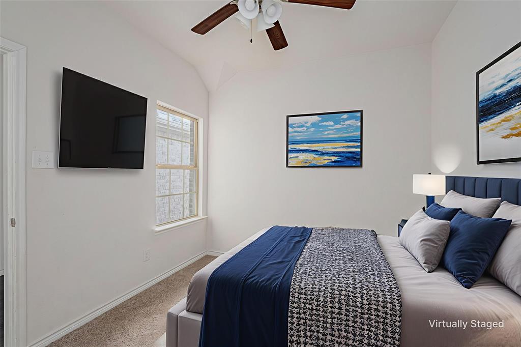1500 Elizabeth Street Anna, TX 75409 - Photo 14 of 25 a bedroom with a bed and a flat screen tv