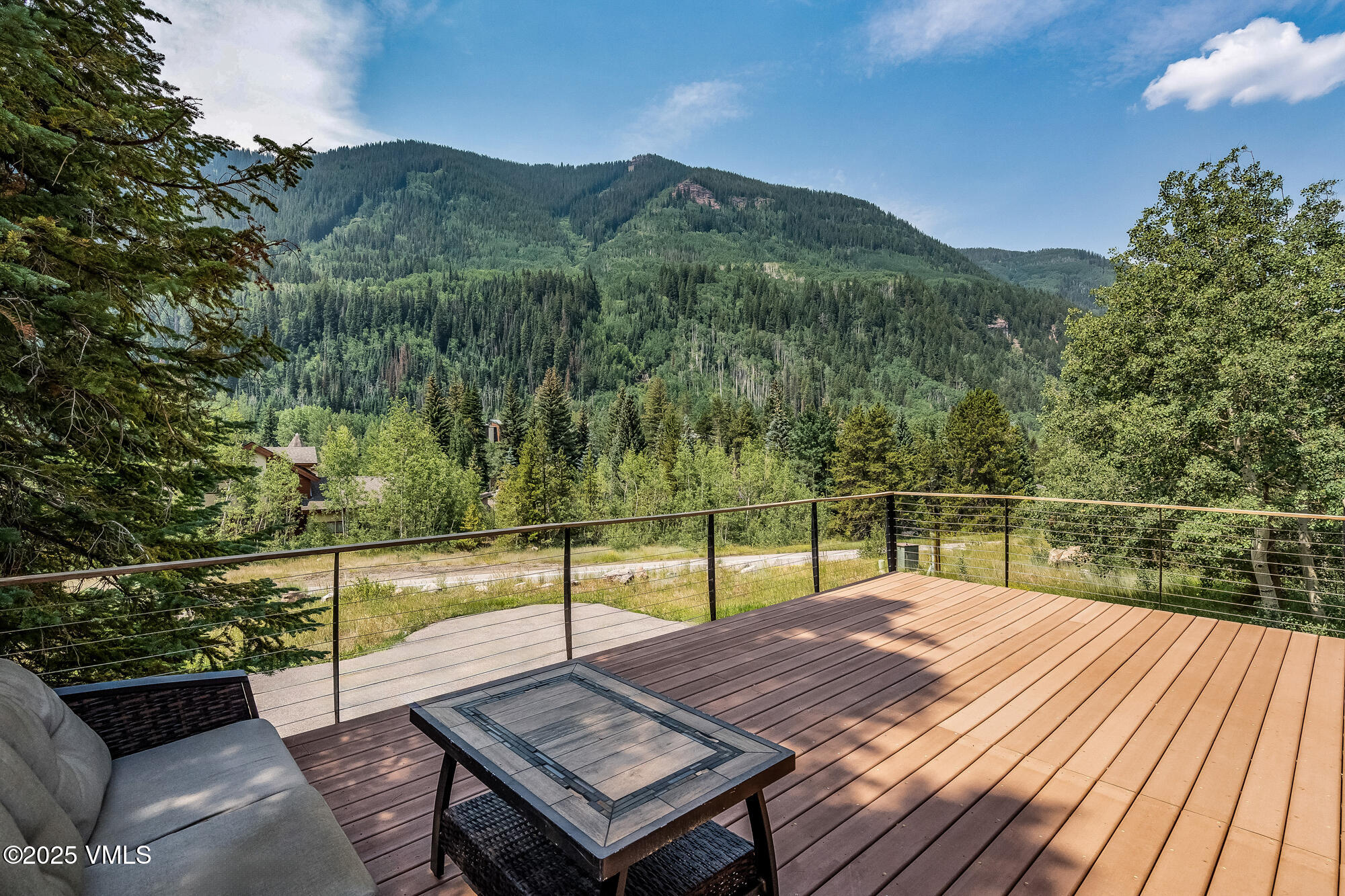 4545 Big Horn Road Vail, CO 81657 - Photo 7 of 49 a view of a terrace with a lake view