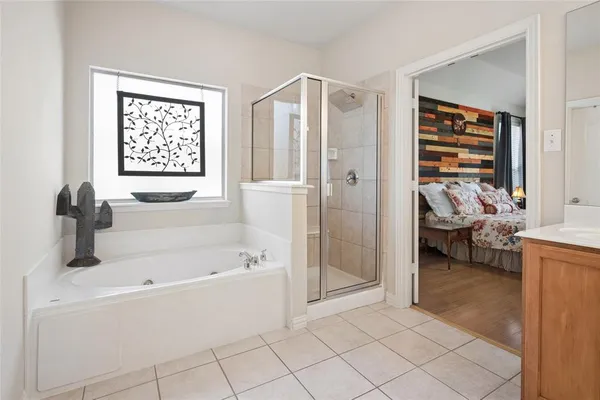 a bathroom with a bathtub and a shower
