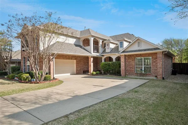 front view of a house with a garden