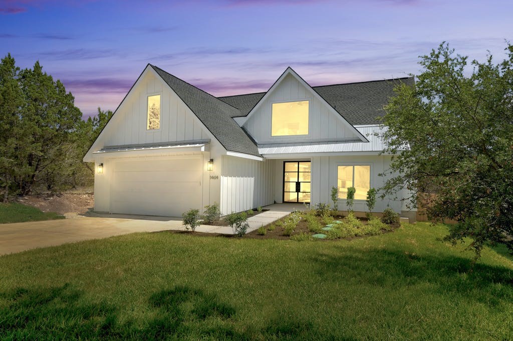 14614 General Williamson Drive Austin, TX 78734 - Photo 1 of 1 a front view of a house with a yard and trees