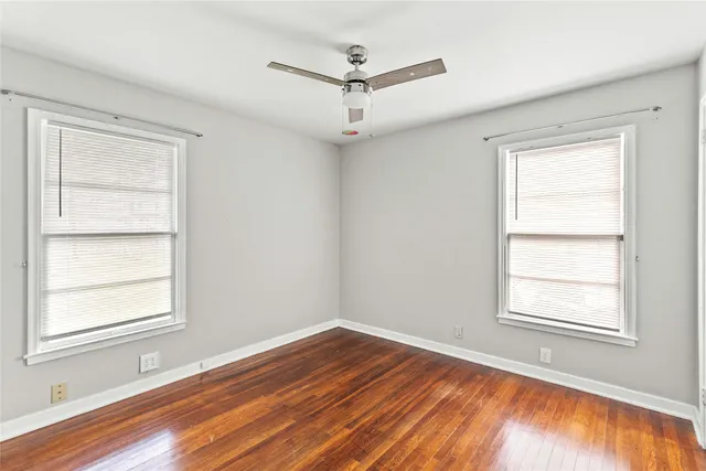 a view of a room with a ceiling fan and a window