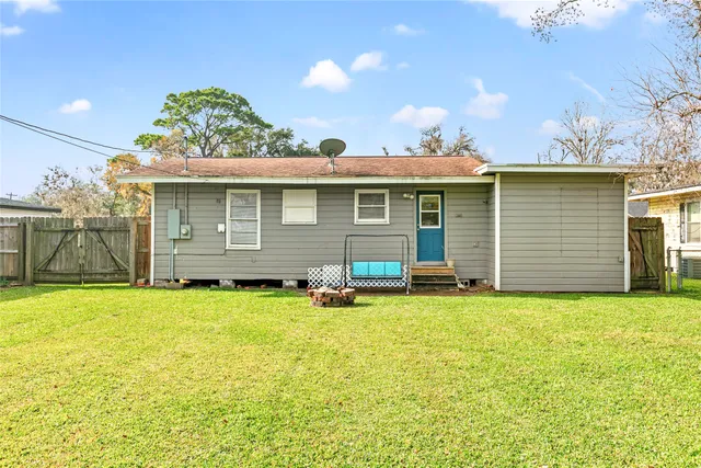 a view of a swimming pool with a yard
