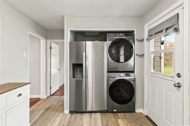 a view of a hallway with washer and dryer