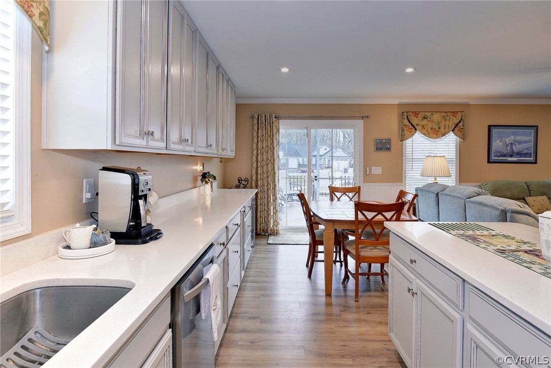 204 Arbordale Loop Williamsburg, VA 23188 - Photo 11 of 41 a kitchen with a dining table chairs and white appliances