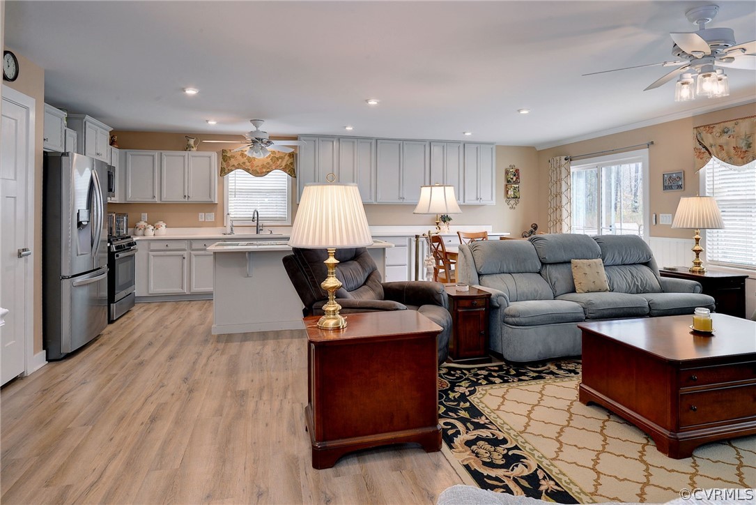 204 Arbordale Loop Williamsburg, VA 23188 - Photo 15 of 41 a living room with stainless steel appliances furniture a rug and a kitchen view