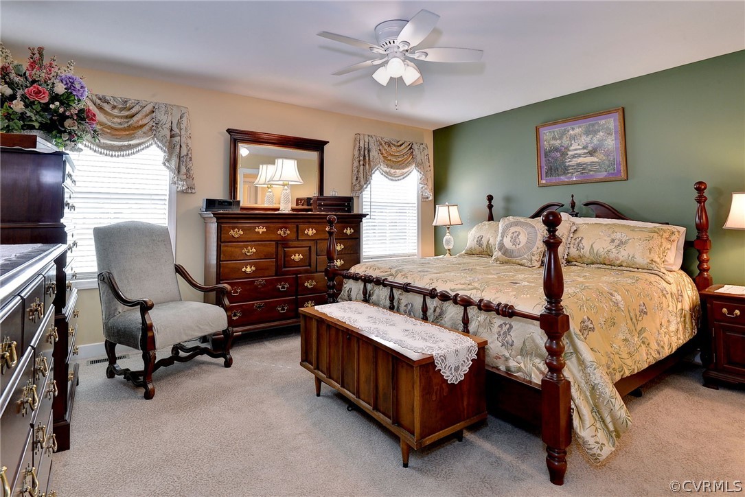 204 Arbordale Loop Williamsburg, VA 23188 - Photo 16 of 41 a bedroom with bed and a chandelier