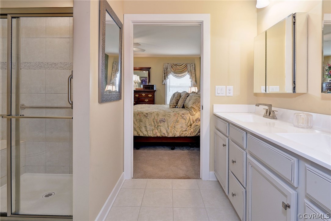 204 Arbordale Loop Williamsburg, VA 23188 - Photo 19 of 41 a en suite bathroom with a tub sink and mirror