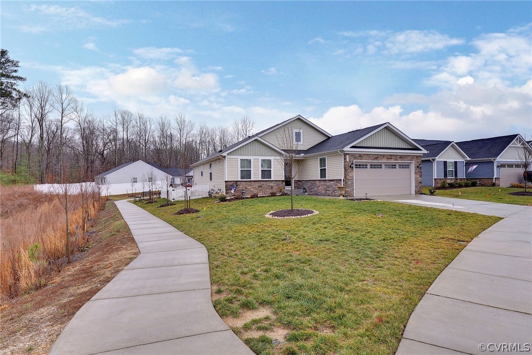 204 Arbordale Loop Williamsburg, VA 23188 - Photo 28 of 41 a view of house with garden space and swimming pool