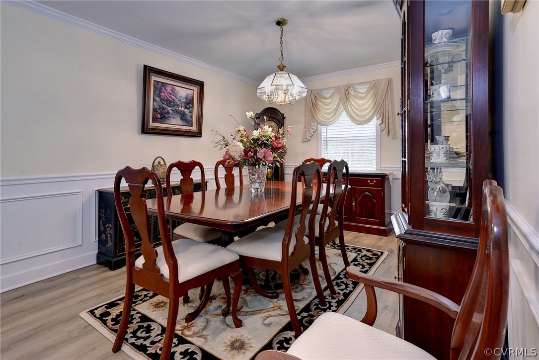 204 Arbordale Loop Williamsburg, VA 23188 - Photo 5 of 41 a very nice looking dining room with furniture a chandelier and wooden floor