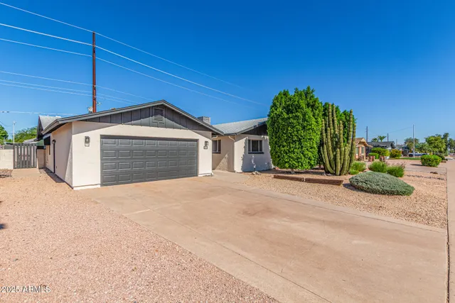 a view of garage and yard