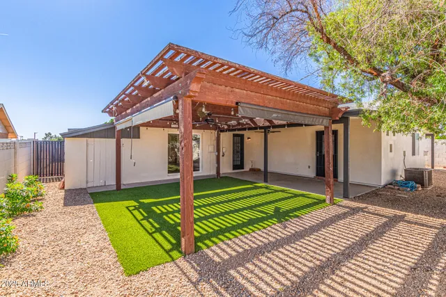 a front view of a house with a yard and porch