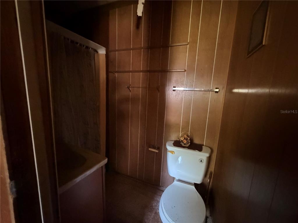 56340 Acorn Road Astor, FL 32102 - Photo 15 of 21 a bathroom with a toilet and a shower