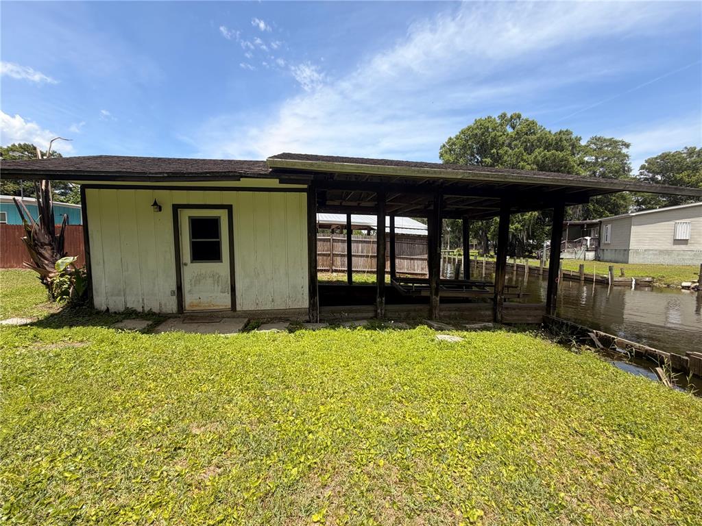 56340 Acorn Road Astor, FL 32102 - Photo 17 of 21 a view of a backyard