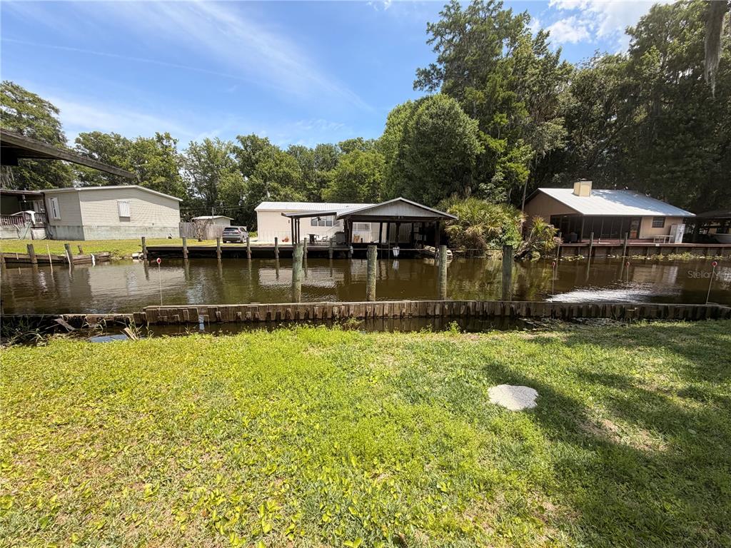 56340 Acorn Road Astor, FL 32102 - Photo 18 of 21 a view of a house with a yard
