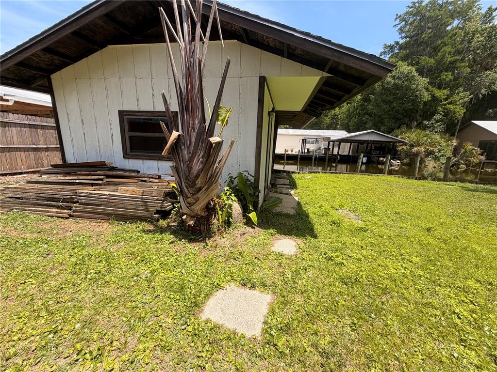 56340 Acorn Road Astor, FL 32102 - Photo 20 of 21 a view of a house with backyard