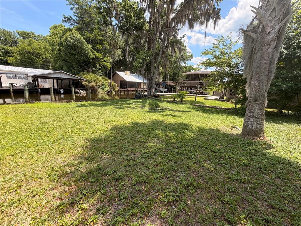 56340 Acorn Road Astor, FL 32102 - Photo 21 of 21 a view of a house with a yard