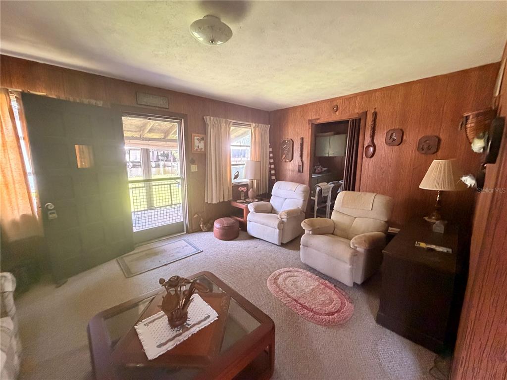 56340 Acorn Road Astor, FL 32102 - Photo 10 of 21 a living room with furniture and a window