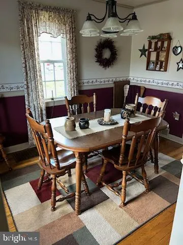 a view of a dining room with furniture