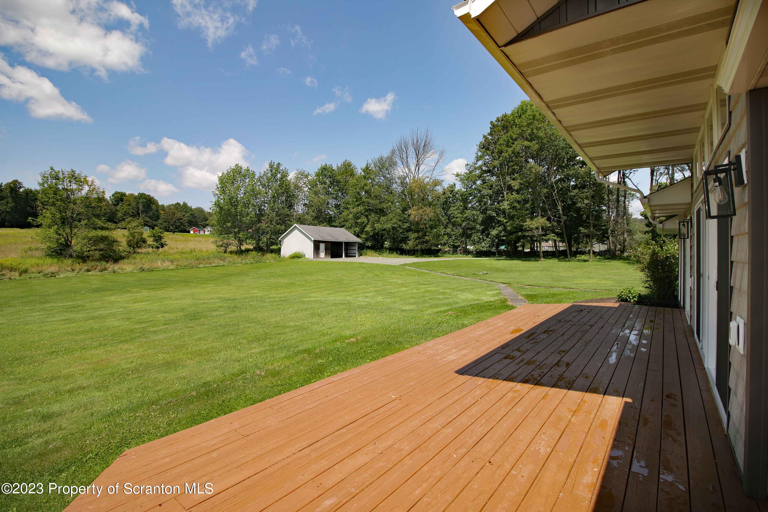 761 Day Road Montrose, PA 18801 - Photo 11 of 62 a view of a backyard with green space