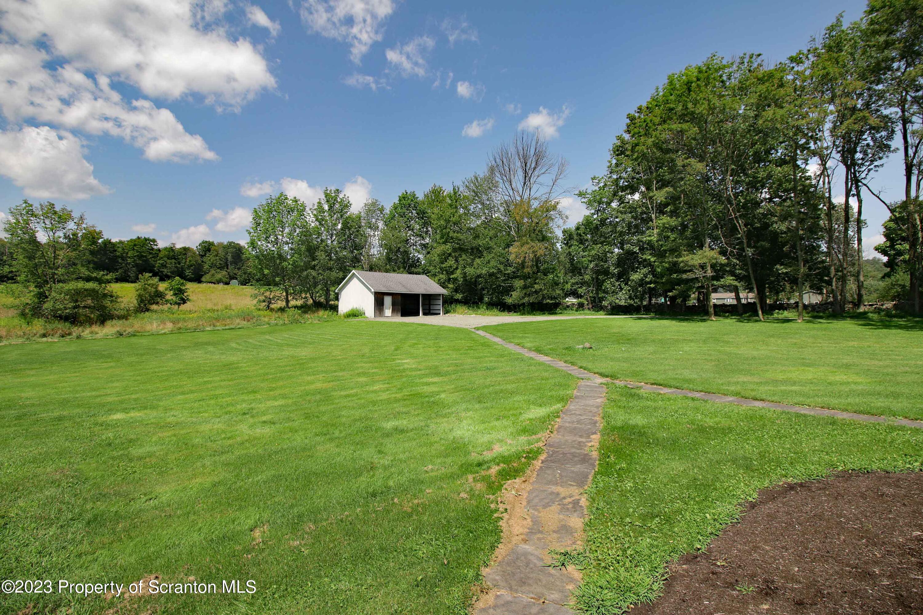 761 Day Road Montrose, PA 18801 - Photo 12 of 62 a view of a house with a big yard