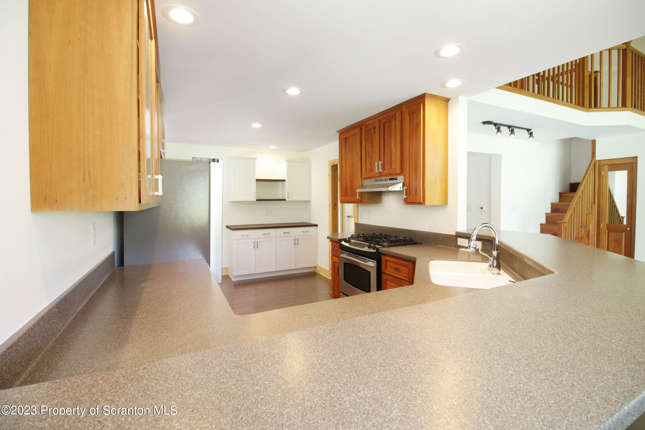 761 Day Road Montrose, PA 18801 - Photo 29 of 62 a kitchen with stainless steel appliances granite countertop a sink and a refrigerator