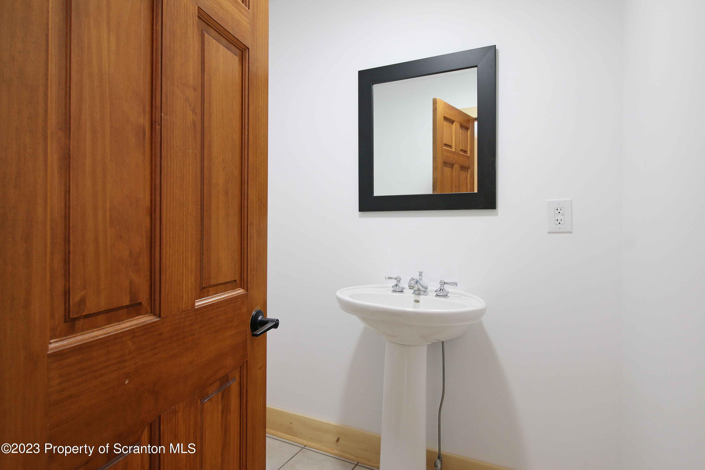 761 Day Road Montrose, PA 18801 - Photo 35 of 62 a bathroom with a sink and a mirror