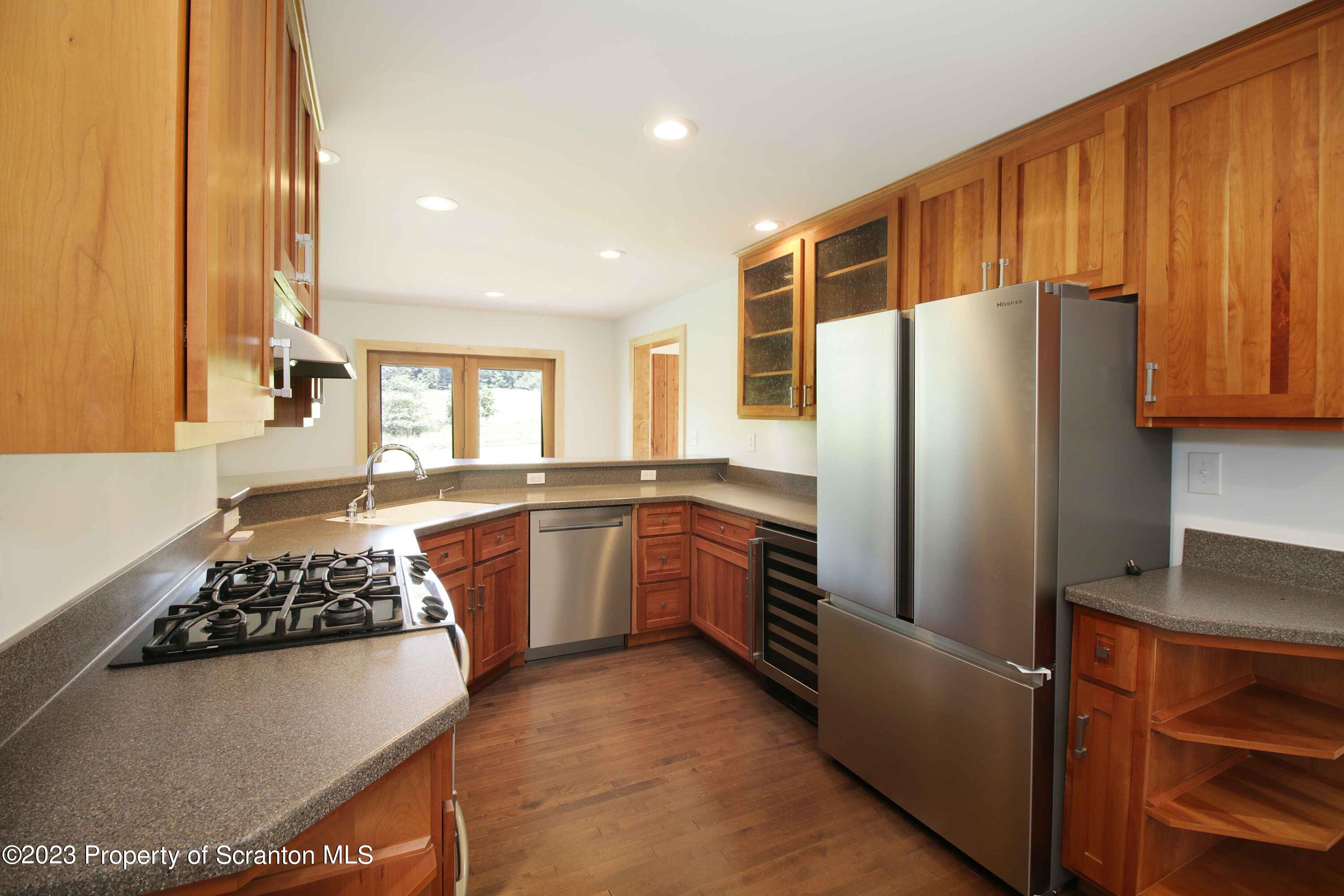 761 Day Road Montrose, PA 18801 - Photo 4 of 62 a kitchen with stainless steel appliances granite countertop a refrigerator and a stove