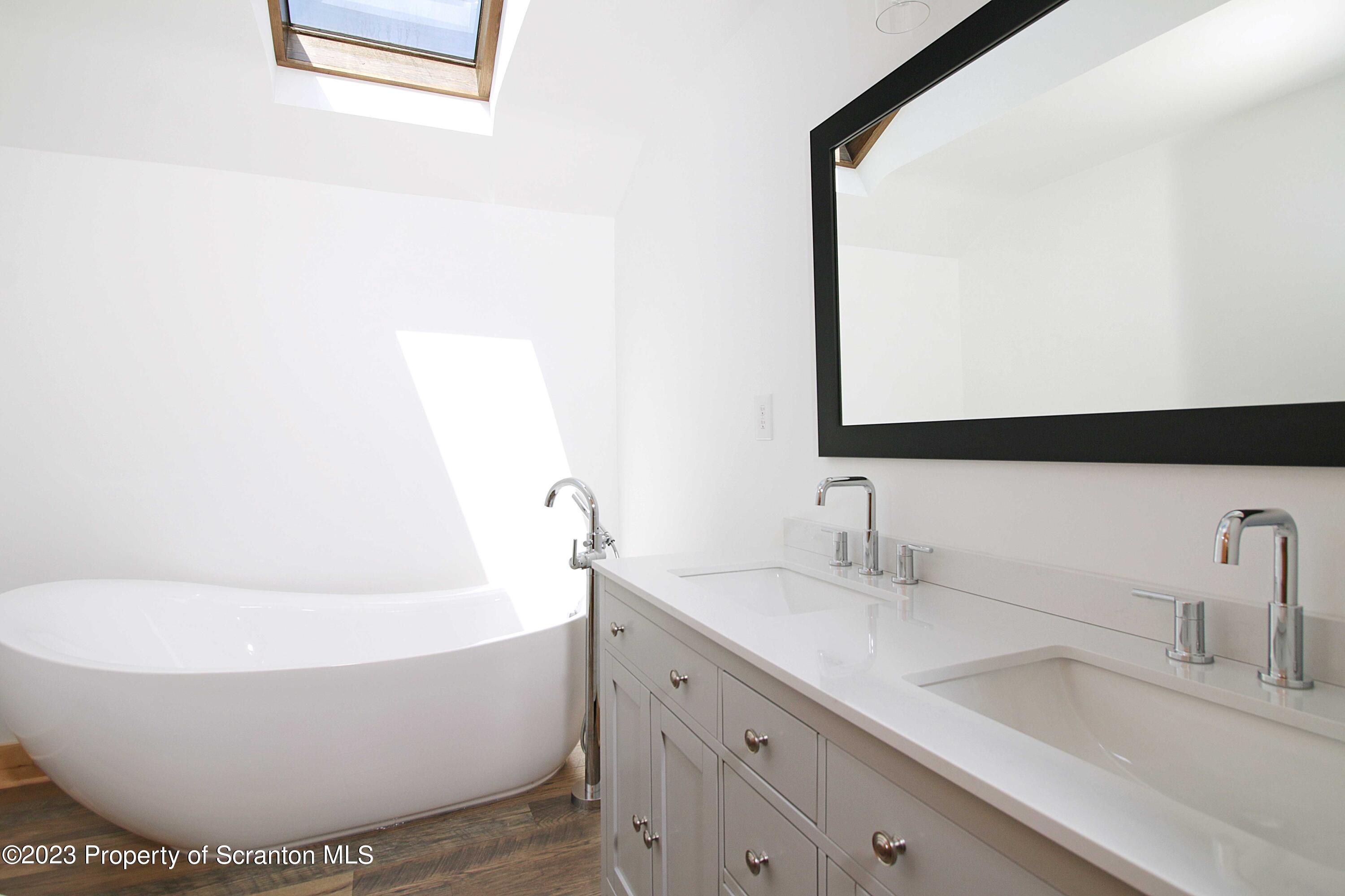 761 Day Road Montrose, PA 18801 - Photo 46 of 62 a bathroom with a sink and a mirror