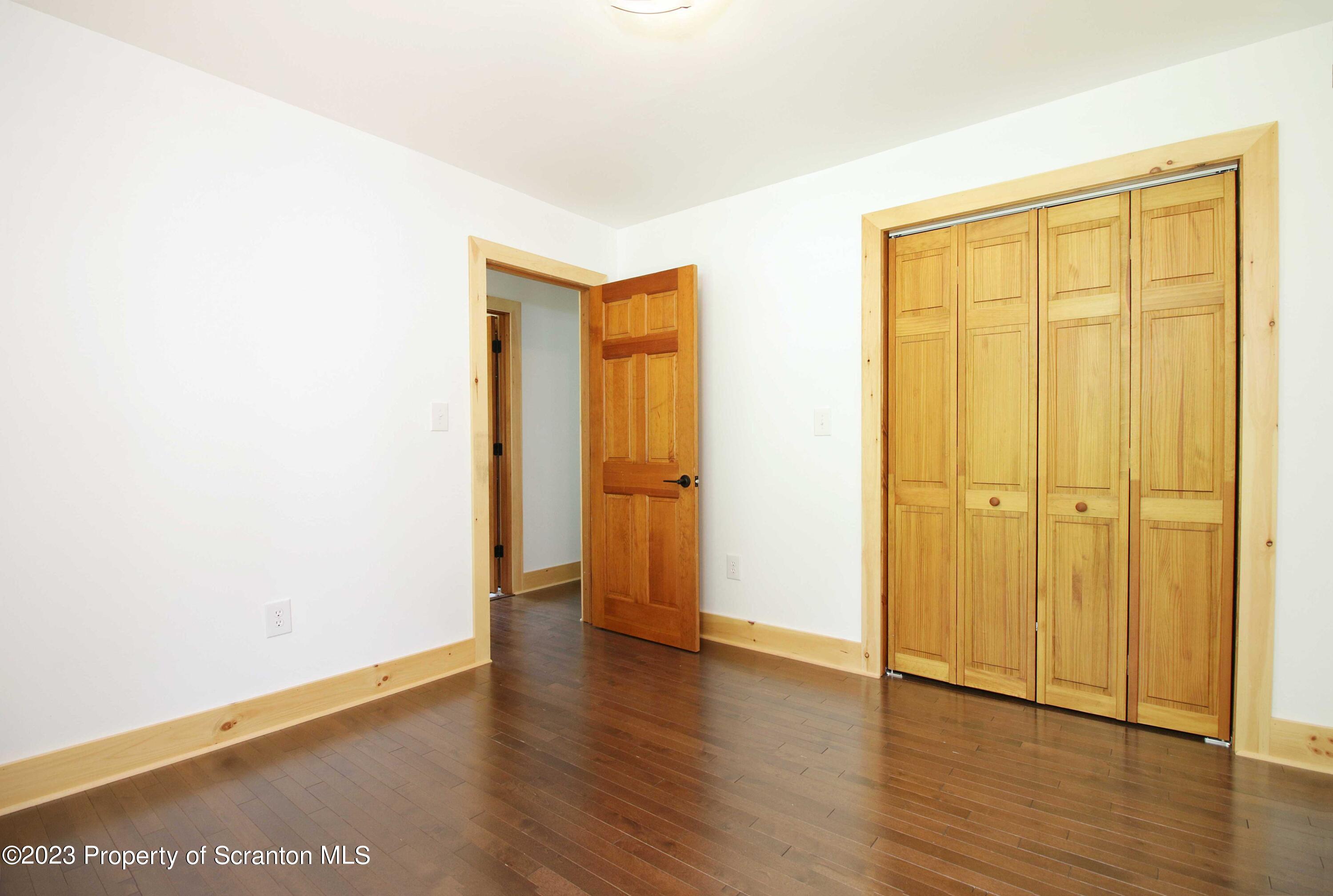 761 Day Road Montrose, PA 18801 - Photo 53 of 62 a view of an empty room with wooden floor and closet