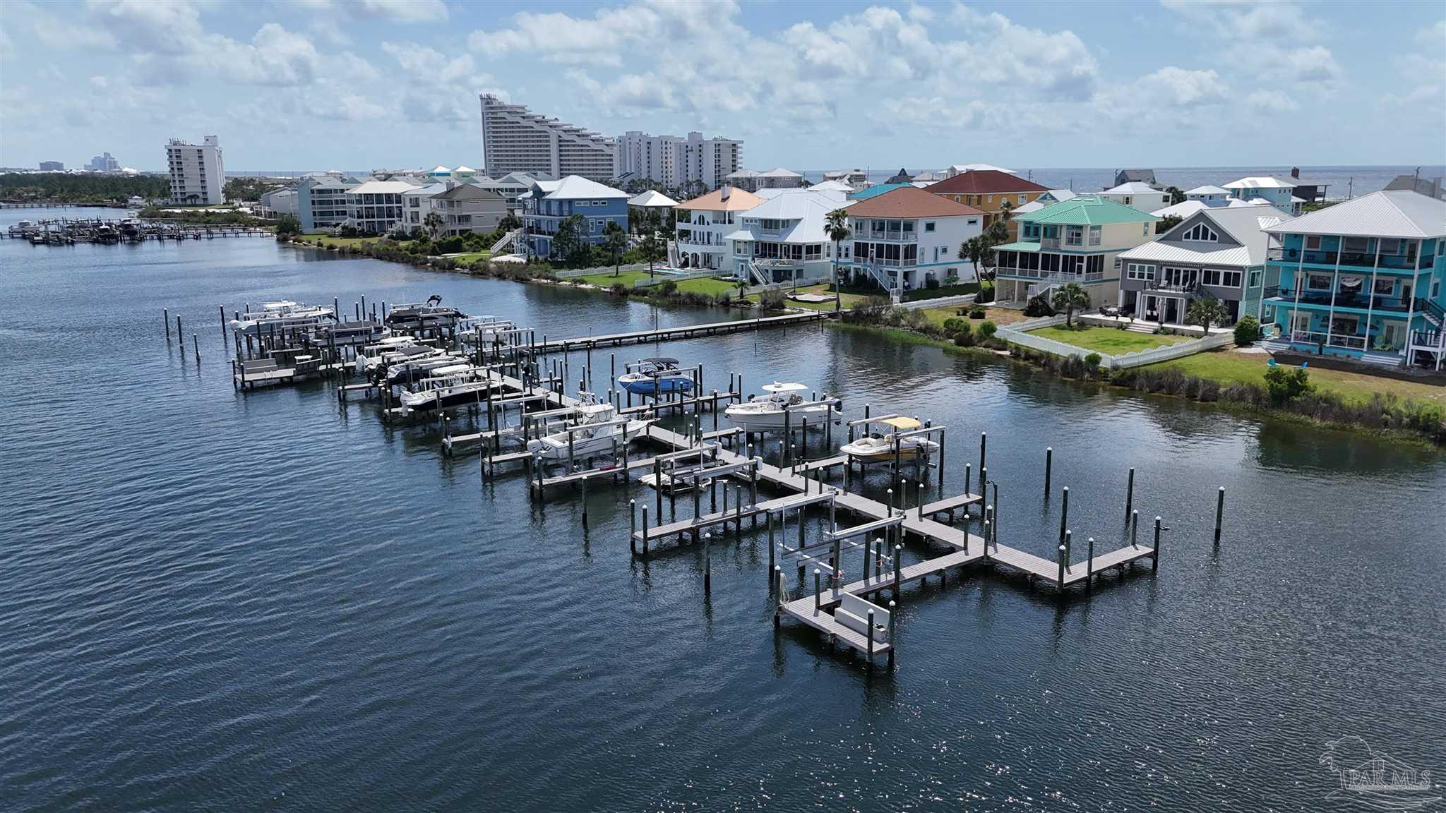 337 Gulfview Lane Perdido Key, FL 32507 - Photo 15 of 27 an aerial view of a house with boats and a lake view