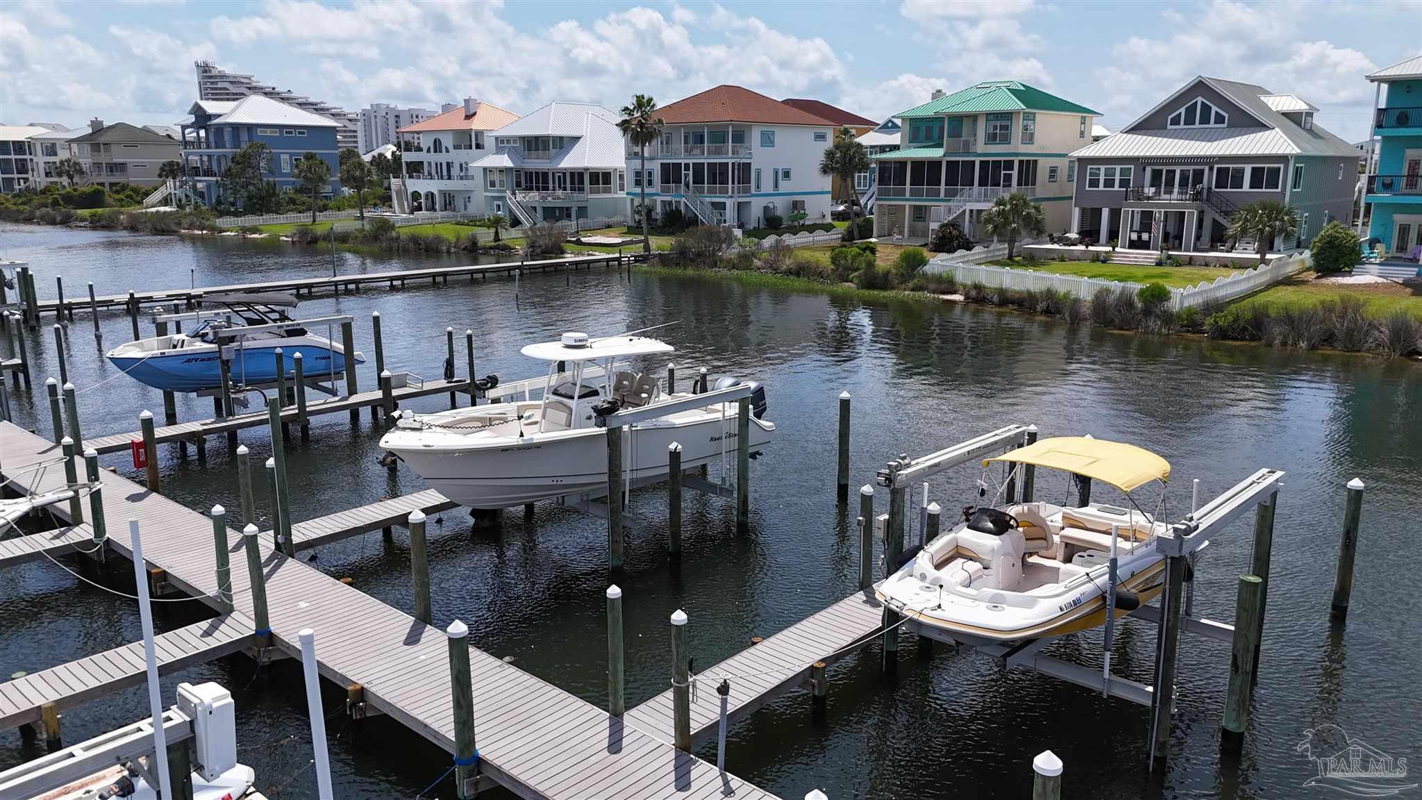 337 Gulfview Lane Perdido Key, FL 32507 - Photo 18 of 27 a view of a lake with a table and chairs