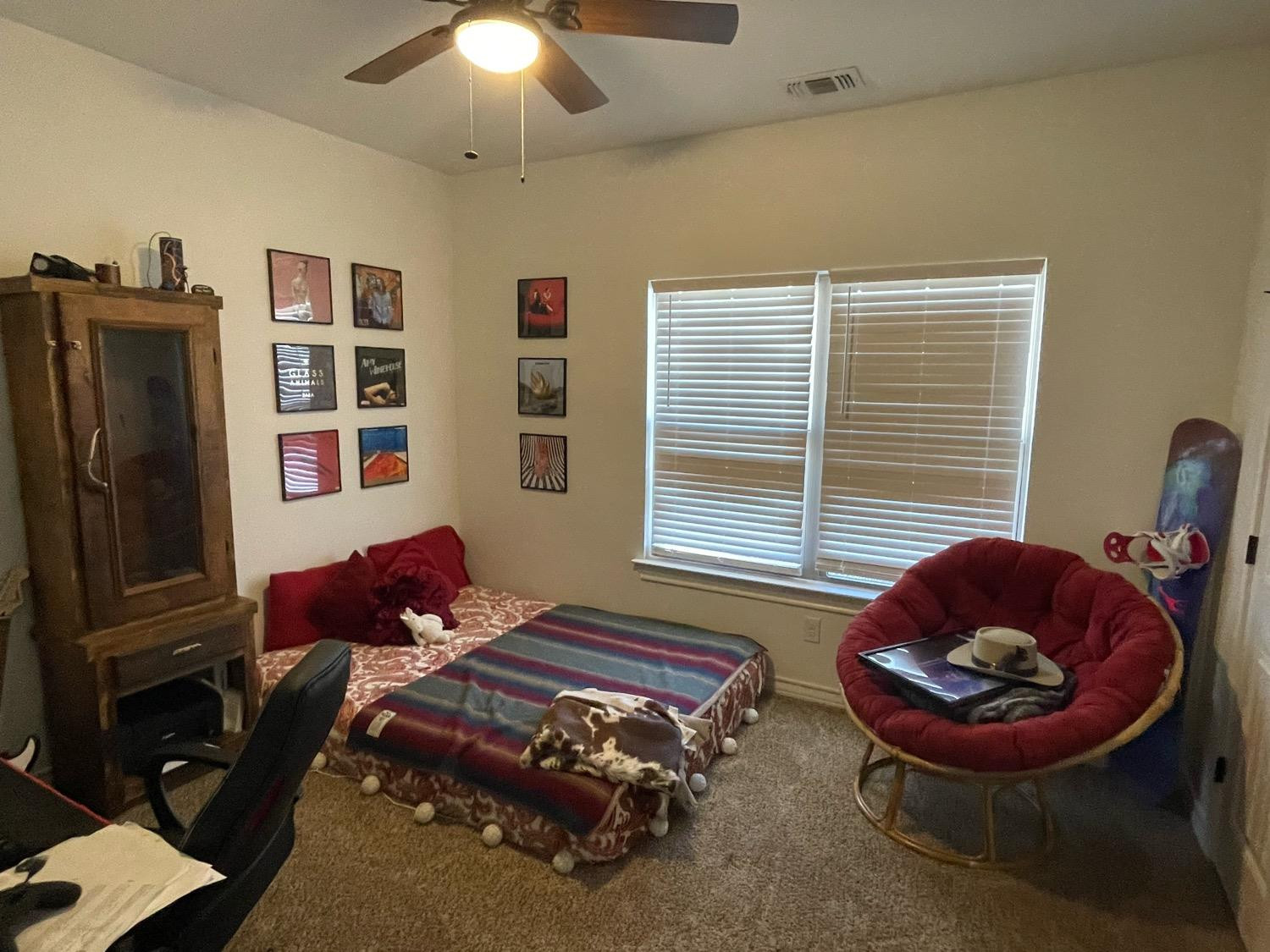 1707 100th Street Lubbock, TX 79423 - Photo 12 of 12 a living room with furniture and a window