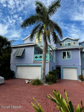 a front view of a house with a garage