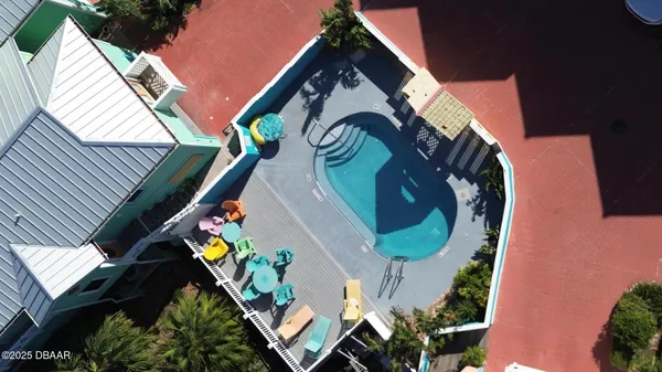 a view of a chairs and table in a patio