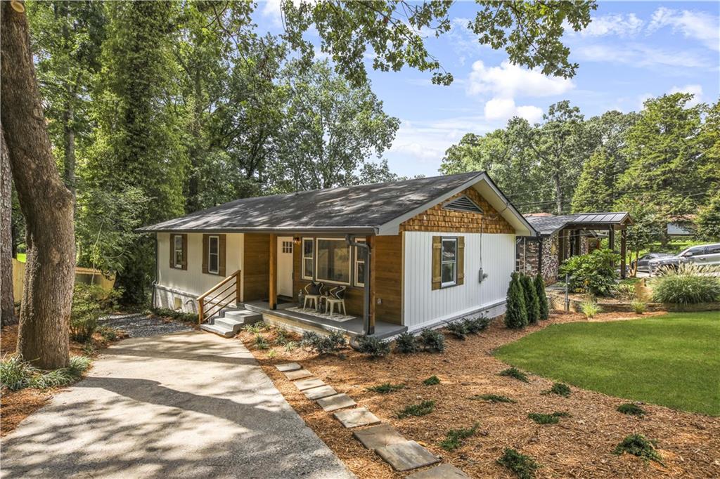 1928 Rogers Avenue Southwest Atlanta, GA 30310 - Photo 1 of 1 a view of a house with a yard