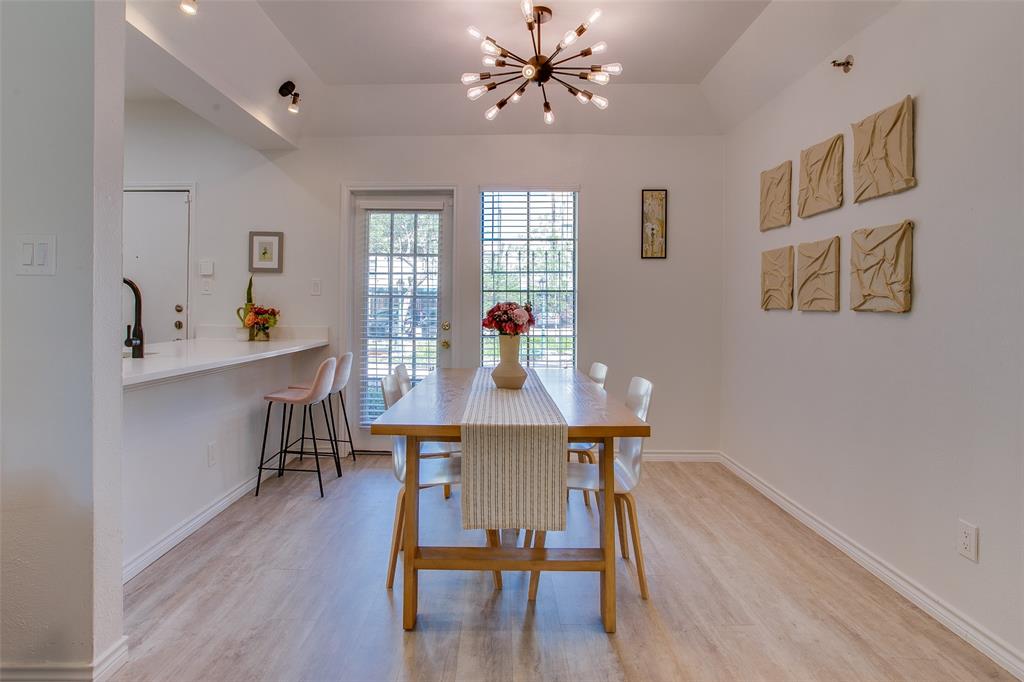 3105 San Jacinto Street, Unit 104 Dallas, TX 75204 - Photo 11 of 36 a view of a dining room with furniture window and wooden floor