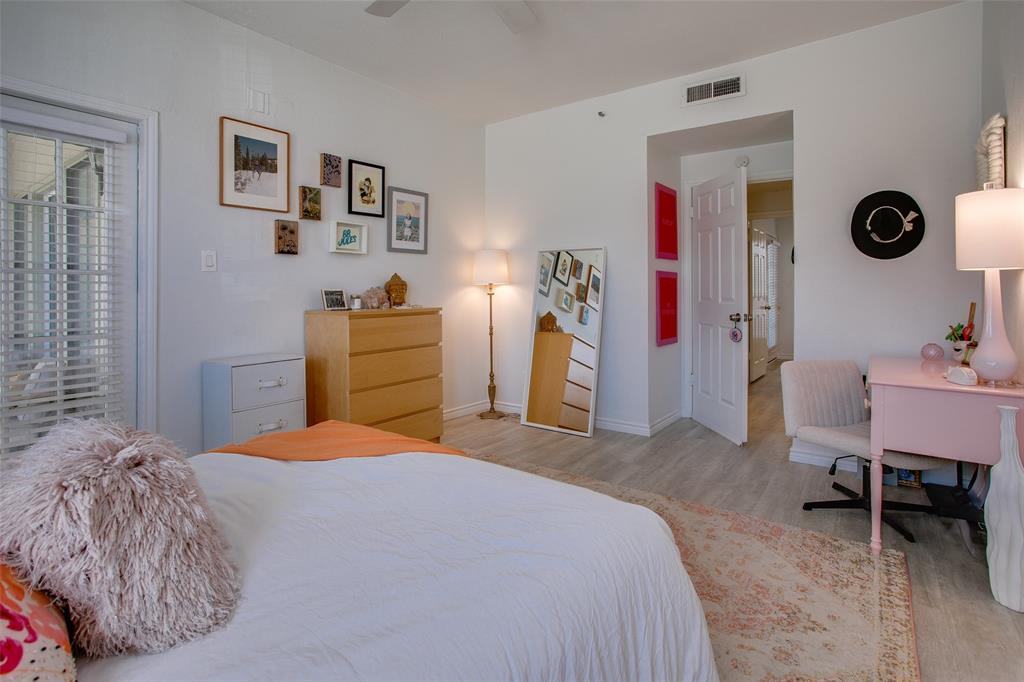 3105 San Jacinto Street, Unit 104 Dallas, TX 75204 - Photo 23 of 36 a bedroom with a bed and a desk