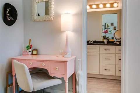 a dining room with a table and chairs