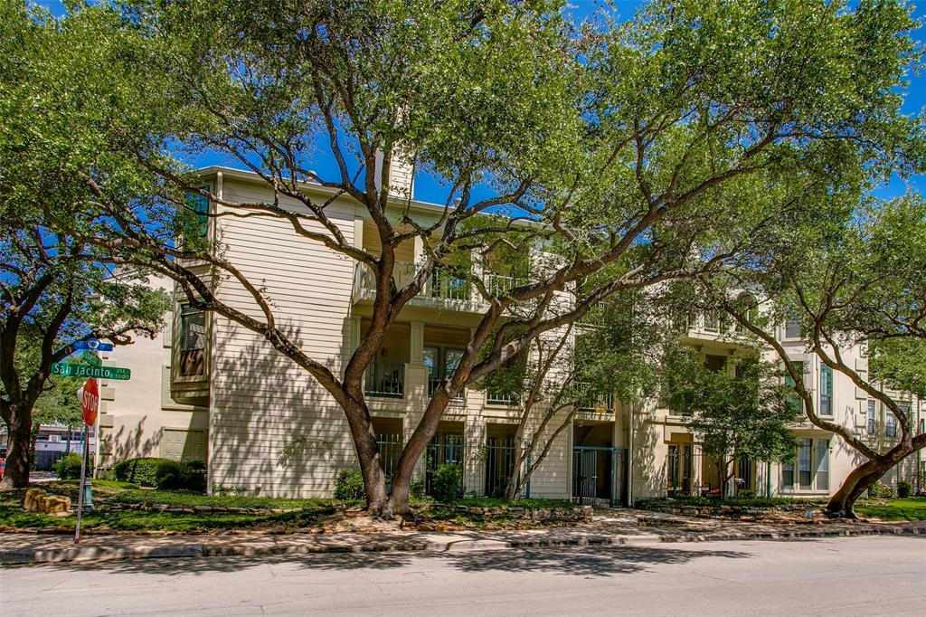 3105 San Jacinto Street, Unit 104 Dallas, TX 75204 - Photo 34 of 36 a front view of a house with a yard