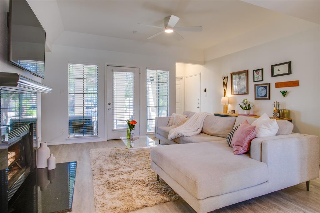 3105 San Jacinto Street, Unit 104 Dallas, TX 75204 - Photo 6 of 36 a living room with furniture and a flat screen tv