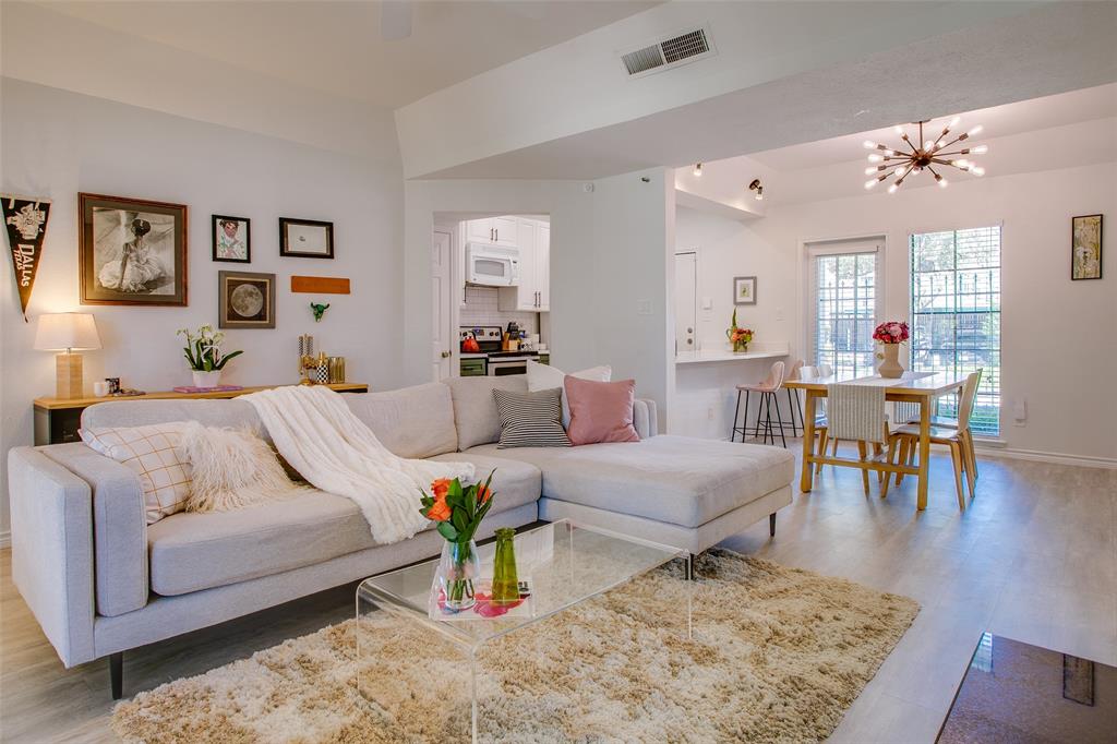 3105 San Jacinto Street, Unit 104 Dallas, TX 75204 - Photo 7 of 36 a living room with furniture and wooden floor